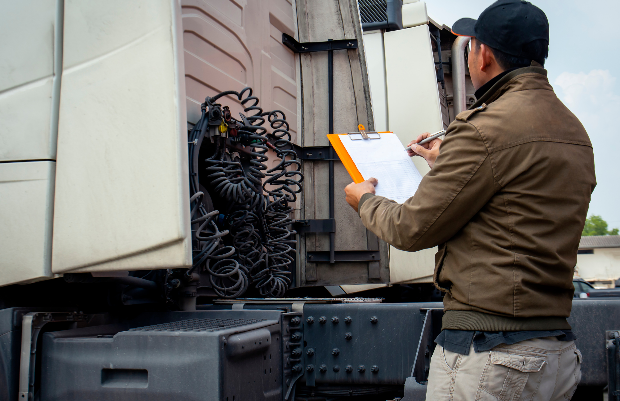 Man inspecting commercial vehicle